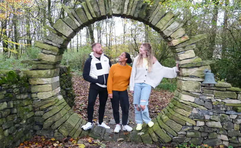 3 People Standing In Archway