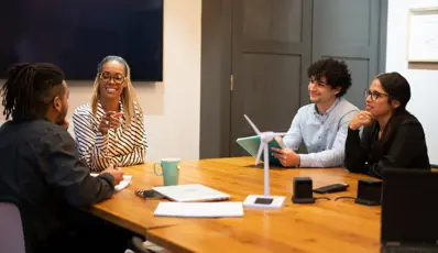 Group of people having a team meeting