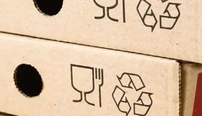 Packaging with recycle symbol in it