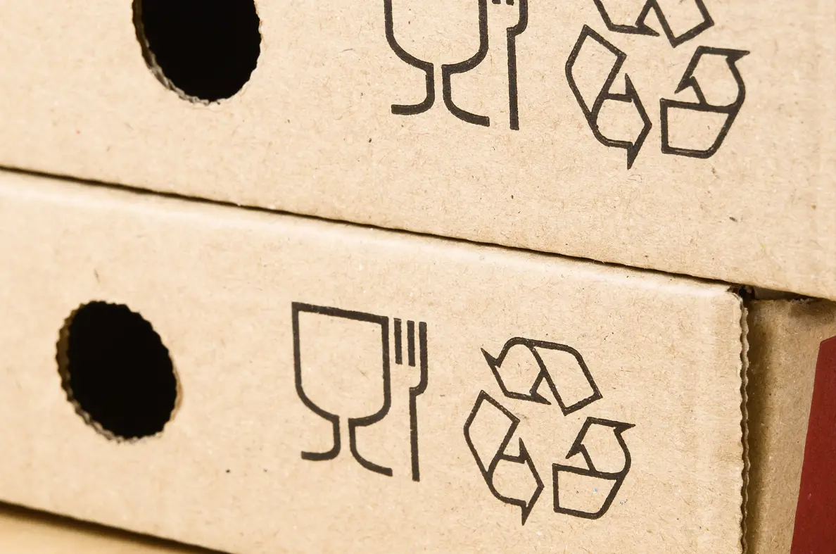 Packaging with recycle symbol in it