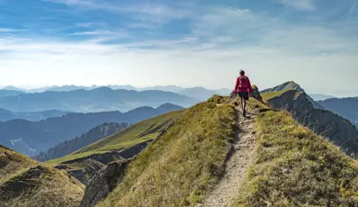 Person walking along the top of a mountain. Amazing views