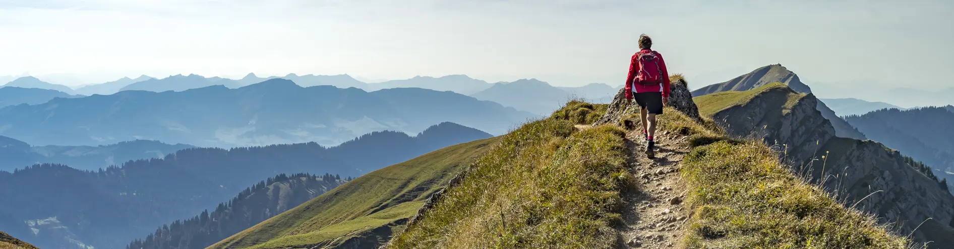 Person walking along the top of a mountain. Amazing views
